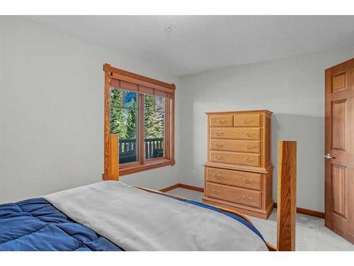 202-150 Crossbow Place, Canmore, AB - Indoor Photo Showing Bedroom