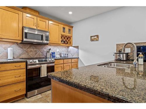 202-150 Crossbow Place, Canmore, AB - Indoor Photo Showing Kitchen With Double Sink