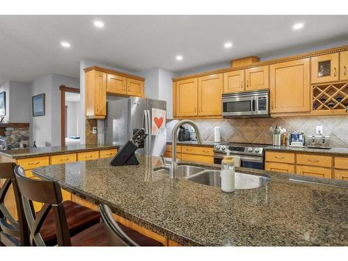 202-150 Crossbow Place, Canmore, AB - Indoor Photo Showing Kitchen With Double Sink With Upgraded Kitchen