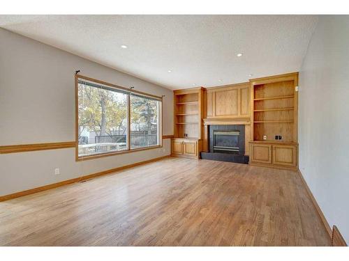 218 Mt Cascade Place Se, Calgary, AB - Indoor Photo Showing Living Room With Fireplace