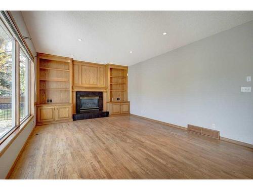 218 Mt Cascade Place Se, Calgary, AB - Indoor Photo Showing Living Room With Fireplace