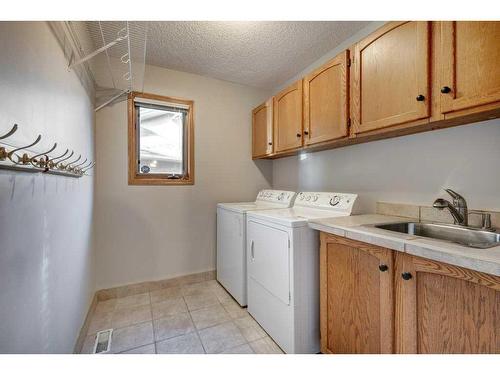 218 Mt Cascade Place Se, Calgary, AB - Indoor Photo Showing Laundry Room