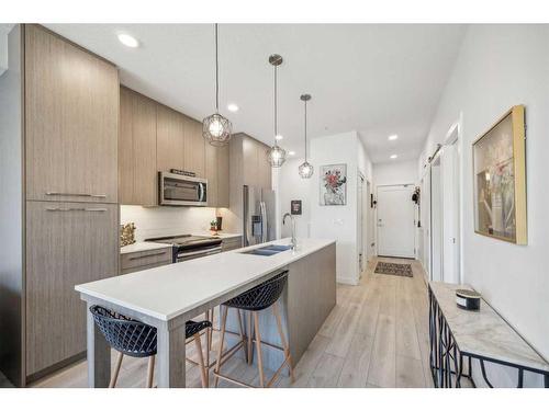 2207-76 Cornerstone Passage Ne, Calgary, AB - Indoor Photo Showing Kitchen With Double Sink With Upgraded Kitchen