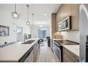 2207-76 Cornerstone Passage Ne, Calgary, AB  - Indoor Photo Showing Kitchen With Double Sink With Upgraded Kitchen 