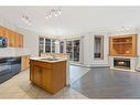 101-108 Edgeridge Terrace Nw, Calgary, AB  - Indoor Photo Showing Kitchen With Fireplace With Double Sink 