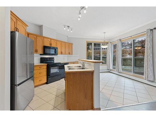 101-108 Edgeridge Terrace Nw, Calgary, AB - Indoor Photo Showing Kitchen With Double Sink