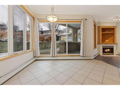 101-108 Edgeridge Terrace Nw, Calgary, AB - Indoor With Fireplace