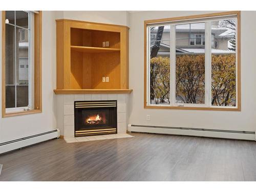 101-108 Edgeridge Terrace Nw, Calgary, AB - Indoor Photo Showing Living Room With Fireplace