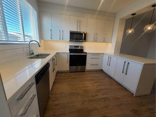 117 Dawson Circle, Chestermere, AB - Indoor Photo Showing Kitchen With Stainless Steel Kitchen With Double Sink