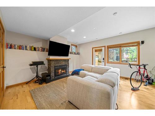 173 Wapiti Close, Canmore, AB - Indoor Photo Showing Other Room With Fireplace