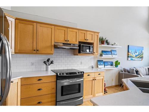 173 Wapiti Close, Canmore, AB - Indoor Photo Showing Kitchen With Double Sink