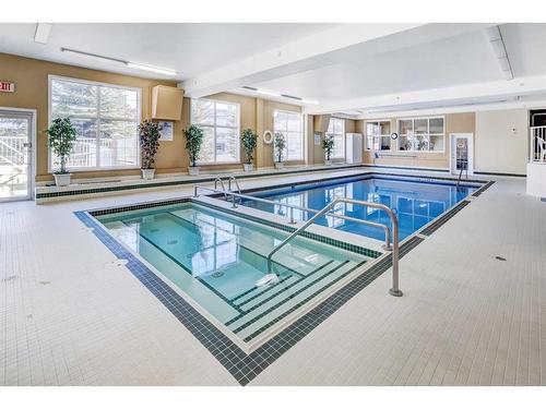 327-728 Country Hills Road Nw, Calgary, AB - Indoor Photo Showing Other Room With In Ground Pool