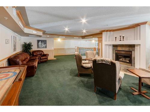 327-728 Country Hills Road Nw, Calgary, AB - Indoor With Fireplace