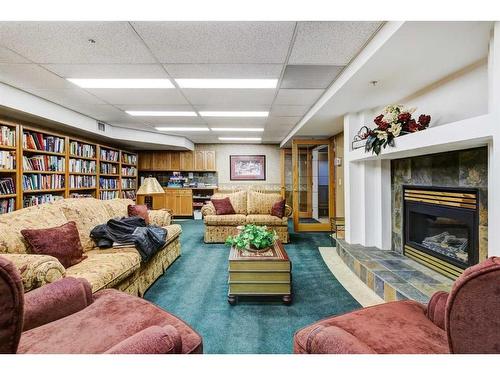 327-728 Country Hills Road Nw, Calgary, AB - Indoor With Fireplace