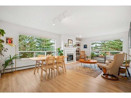 322-2144 Paliswood Road Sw, Calgary, AB - Indoor With Fireplace