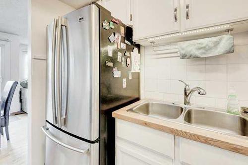 93-200 Shawnessy Drive Sw, Calgary, AB - Indoor Photo Showing Kitchen With Double Sink