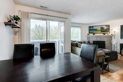 93-200 Shawnessy Drive Sw, Calgary, AB - Indoor With Fireplace