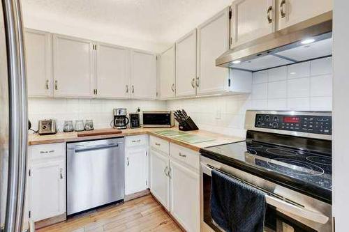 93-200 Shawnessy Drive Sw, Calgary, AB - Indoor Photo Showing Kitchen With Stainless Steel Kitchen