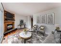 216-15403 Deer Run Drive Se, Calgary, AB  - Indoor Photo Showing Living Room With Fireplace 