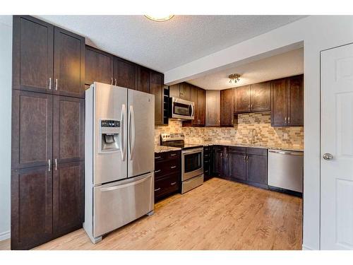 216-15403 Deer Run Drive Se, Calgary, AB - Indoor Photo Showing Kitchen With Stainless Steel Kitchen With Upgraded Kitchen