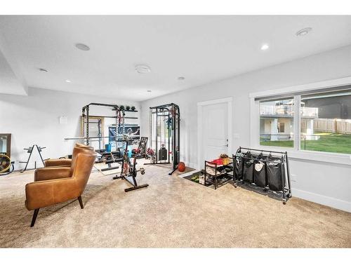 219 Kinniburgh Place, Chestermere, AB - Indoor Photo Showing Gym Room