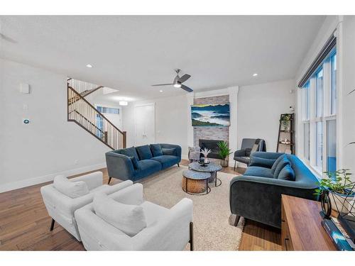 219 Kinniburgh Place, Chestermere, AB - Indoor Photo Showing Living Room With Fireplace