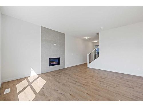 215 Dawson Harbour Court, Chestermere, AB - Indoor Photo Showing Living Room With Fireplace