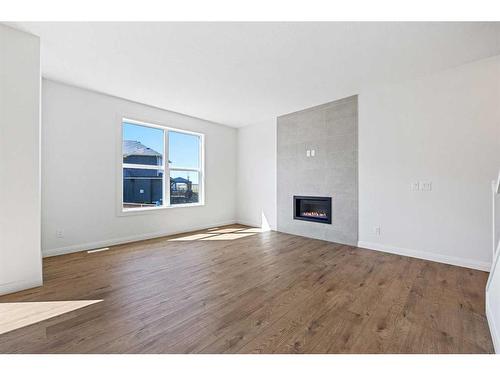 215 Dawson Harbour Court, Chestermere, AB - Indoor Photo Showing Living Room With Fireplace