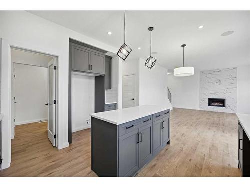 235 Dawson Harbour Court, Chestermere, AB - Indoor Photo Showing Kitchen With Fireplace