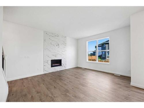 235 Dawson Harbour Court, Chestermere, AB - Indoor Photo Showing Living Room With Fireplace