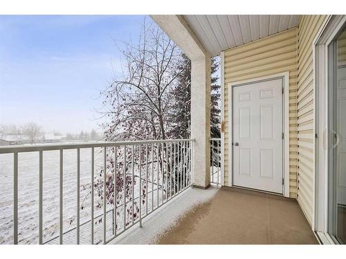 #216-72 Quigley Drive, Cochrane, AB - Outdoor With Exterior