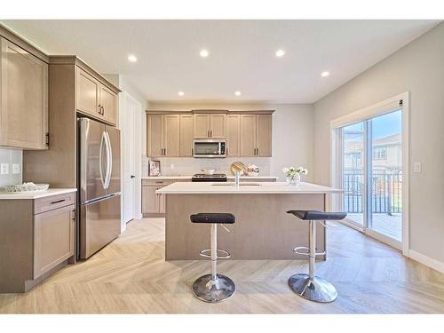 48 Shawnee Green Sw, Calgary, AB - Indoor Photo Showing Kitchen With Stainless Steel Kitchen With Upgraded Kitchen