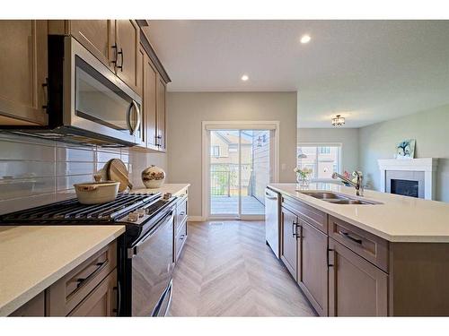 48 Shawnee Green Sw, Calgary, AB - Indoor Photo Showing Kitchen With Double Sink