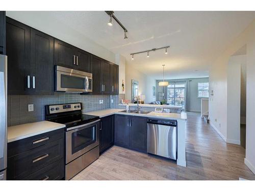 222 Nolanfield Villas Nw, Calgary, AB - Indoor Photo Showing Kitchen With Stainless Steel Kitchen With Double Sink With Upgraded Kitchen