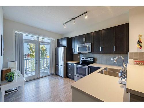 222 Nolanfield Villas Nw, Calgary, AB - Indoor Photo Showing Kitchen With Stainless Steel Kitchen With Double Sink With Upgraded Kitchen