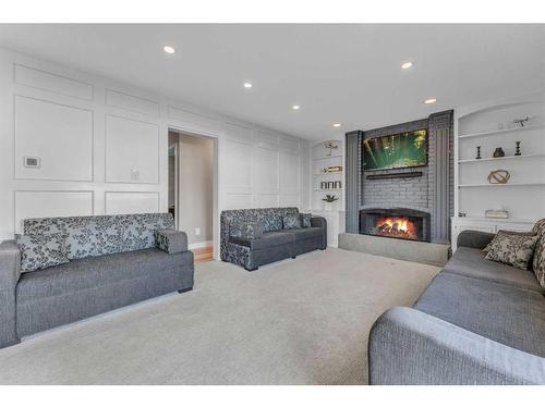 304 Pinemill Way Ne, Calgary, AB - Indoor Photo Showing Living Room With Fireplace