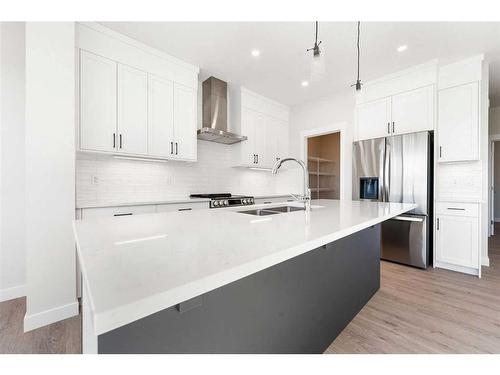 11 Creekstone Gardens Sw, Calgary, AB - Indoor Photo Showing Kitchen With Stainless Steel Kitchen With Double Sink With Upgraded Kitchen