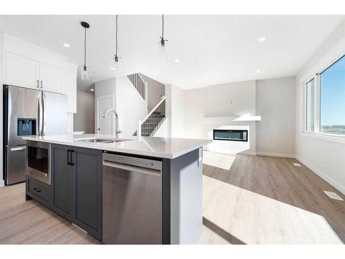 11 Creekstone Gardens Sw, Calgary, AB - Indoor Photo Showing Kitchen With Stainless Steel Kitchen With Double Sink With Upgraded Kitchen