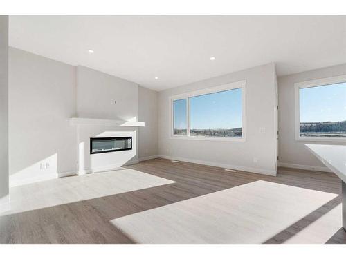 11 Creekstone Gardens Sw, Calgary, AB - Indoor Photo Showing Living Room With Fireplace