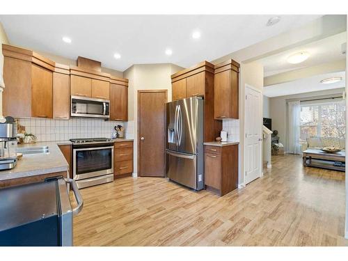 2037 New Brighton Park Se, Calgary, AB - Indoor Photo Showing Kitchen With Double Sink