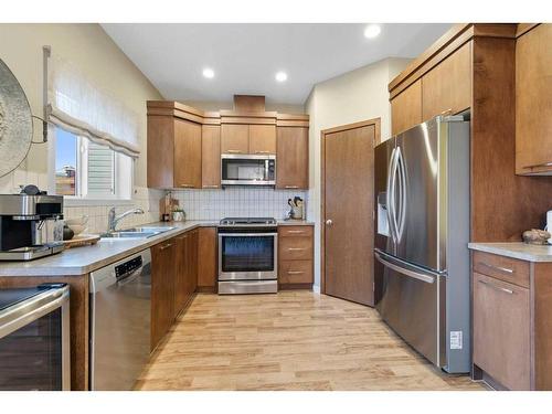 2037 New Brighton Park Se, Calgary, AB - Indoor Photo Showing Kitchen With Double Sink