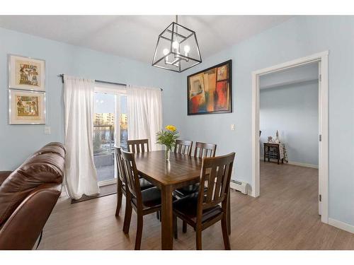 105-4250 Seton Drive Se, Calgary, AB - Indoor Photo Showing Dining Room