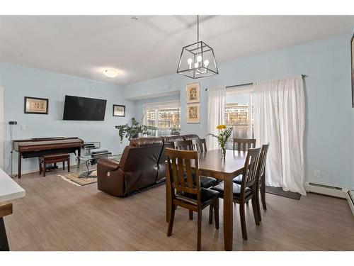 105-4250 Seton Drive Se, Calgary, AB - Indoor Photo Showing Dining Room