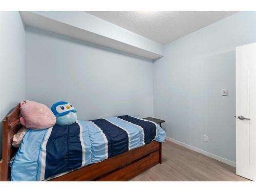 105-4250 Seton Drive Se, Calgary, AB - Indoor Photo Showing Bedroom