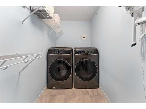 105-4250 Seton Drive Se, Calgary, AB - Indoor Photo Showing Laundry Room