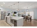 105-4250 Seton Drive Se, Calgary, AB  - Indoor Photo Showing Kitchen With Stainless Steel Kitchen With Upgraded Kitchen 