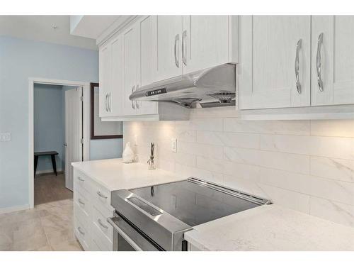 105-4250 Seton Drive Se, Calgary, AB - Indoor Photo Showing Kitchen With Upgraded Kitchen