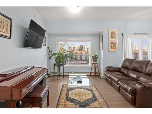 105-4250 Seton Drive Se, Calgary, AB - Indoor Photo Showing Living Room