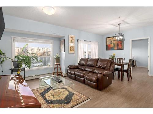 105-4250 Seton Drive Se, Calgary, AB - Indoor Photo Showing Living Room