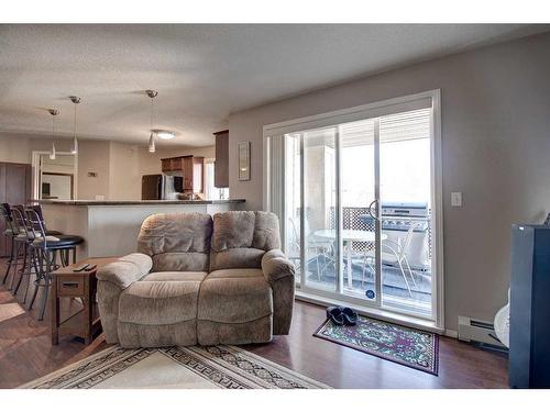 7413-304 Mackenzie Way Sw, Airdrie, AB - Indoor Photo Showing Living Room